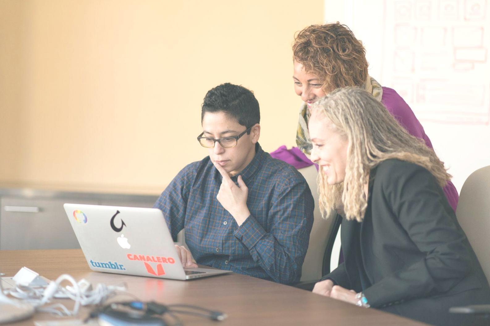 Team meeting discussing client analysis strategies